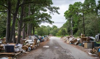 an insurance adjuster surveys damage from harvey